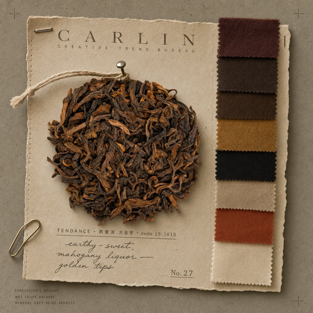 Golden-bud ripe pu-erh laid on cream deckle paper beside a column of pinked fabric swatches in browns and terracotta